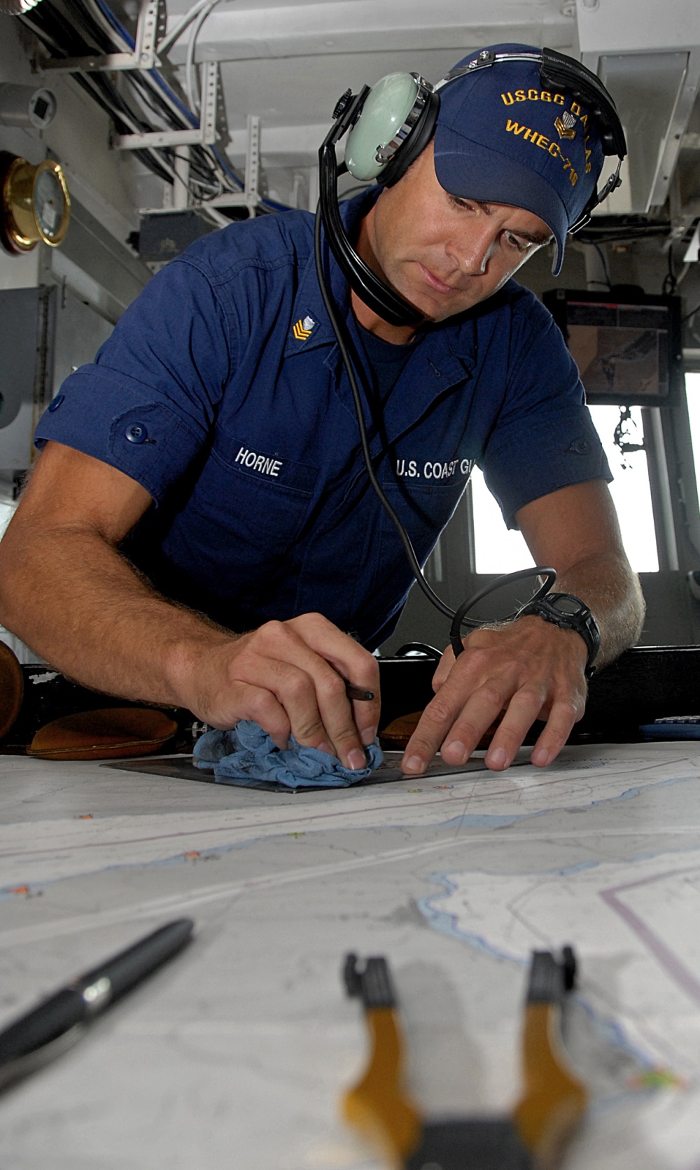Chief Horne at the chart table during a deployment aboard the cutter Dallas. (U.S. Coast Guard) Chief Horne at the chart table during a deployment aboard the cutter Dallas. (U.S. Coast Guard)